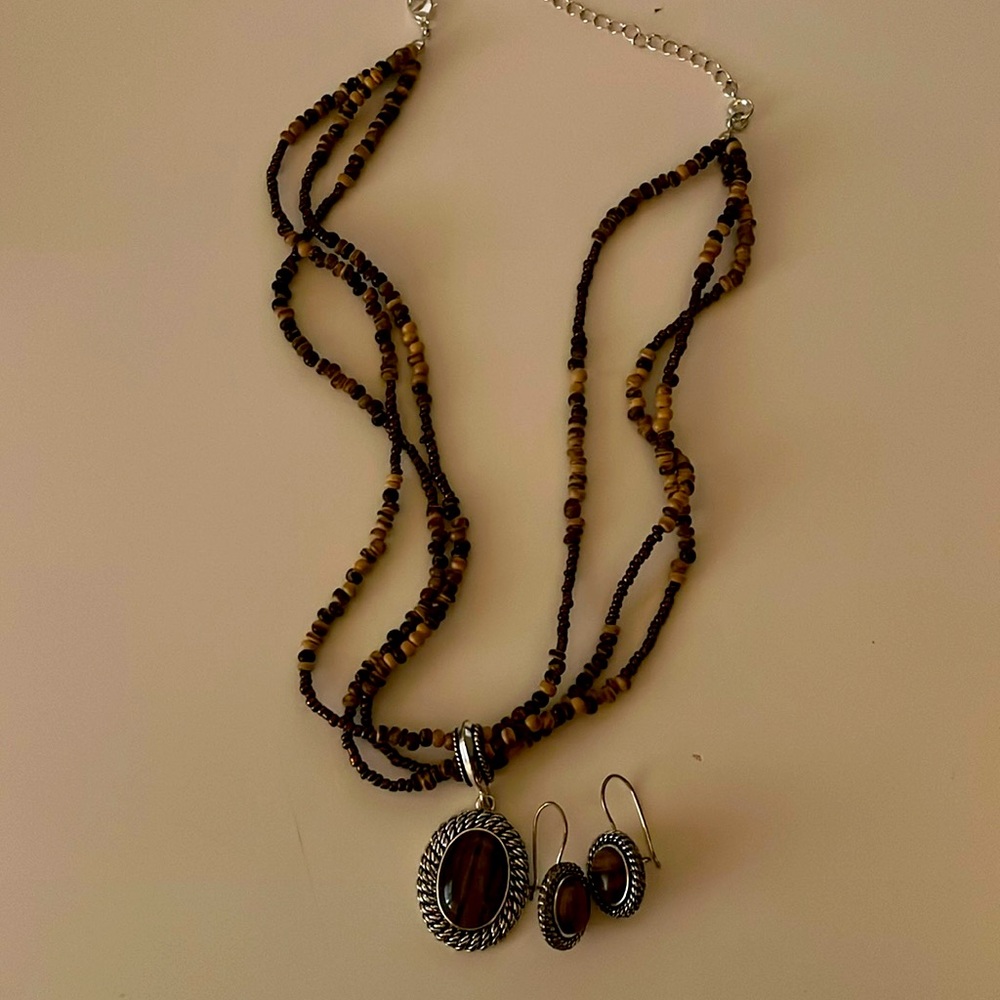 Brown and bronze beaded necklace, pendant, and earrings